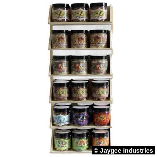 Mystic Sutra resin jars on a wooden shelf display at a wellness store