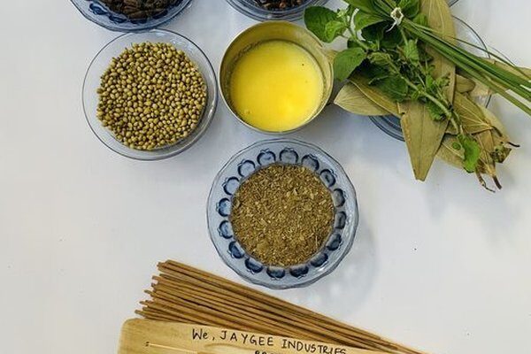 Dried herbs and spices laid out — ingredients for Mother Incense natural masala sticks