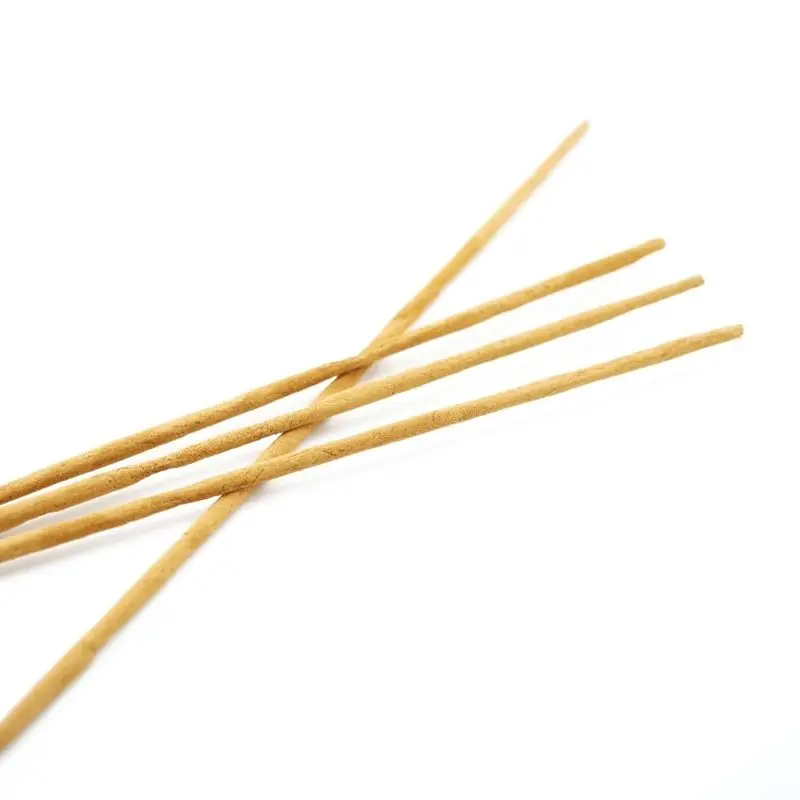 Mother Incense individual incense sticks crossed on white background — natural masala stick detail